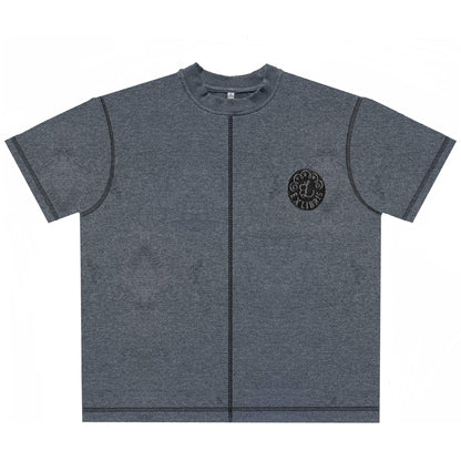 Gray short-sleeve t-shirt with black vertical seam and round logo patch on chest