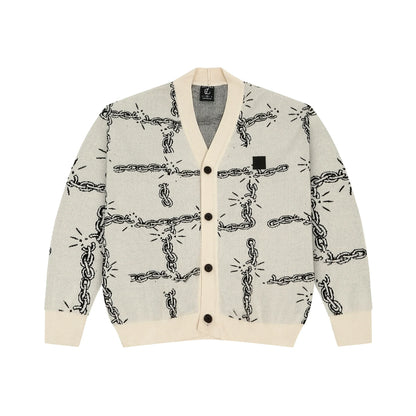 Light gray cardigan with black chain link pattern and cream ribbed collar, cuffs, and hem