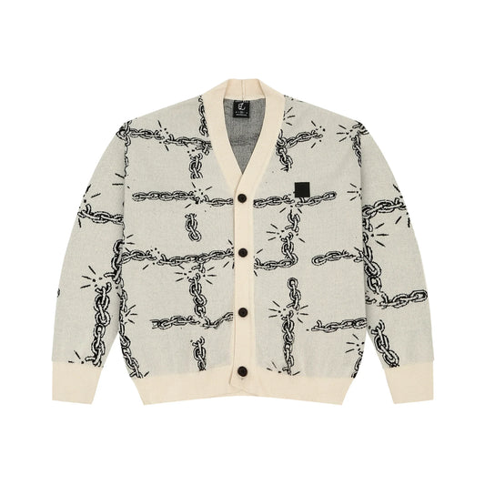 Light gray cardigan with black chain link pattern and cream ribbed collar, cuffs, and hem